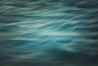 Gentle waves painted in soothing blues and greens, capturing the ebb and flow of emotion.