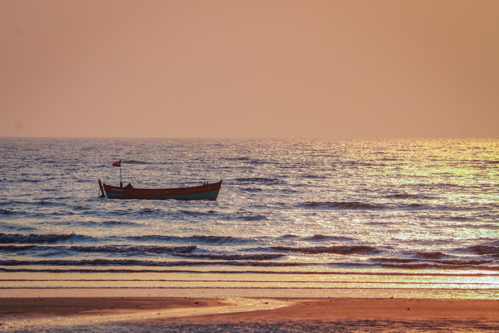 a small boat floating on top of a body of water