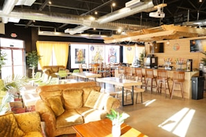 A charming cafe with comfortable seating and vibrant decor.