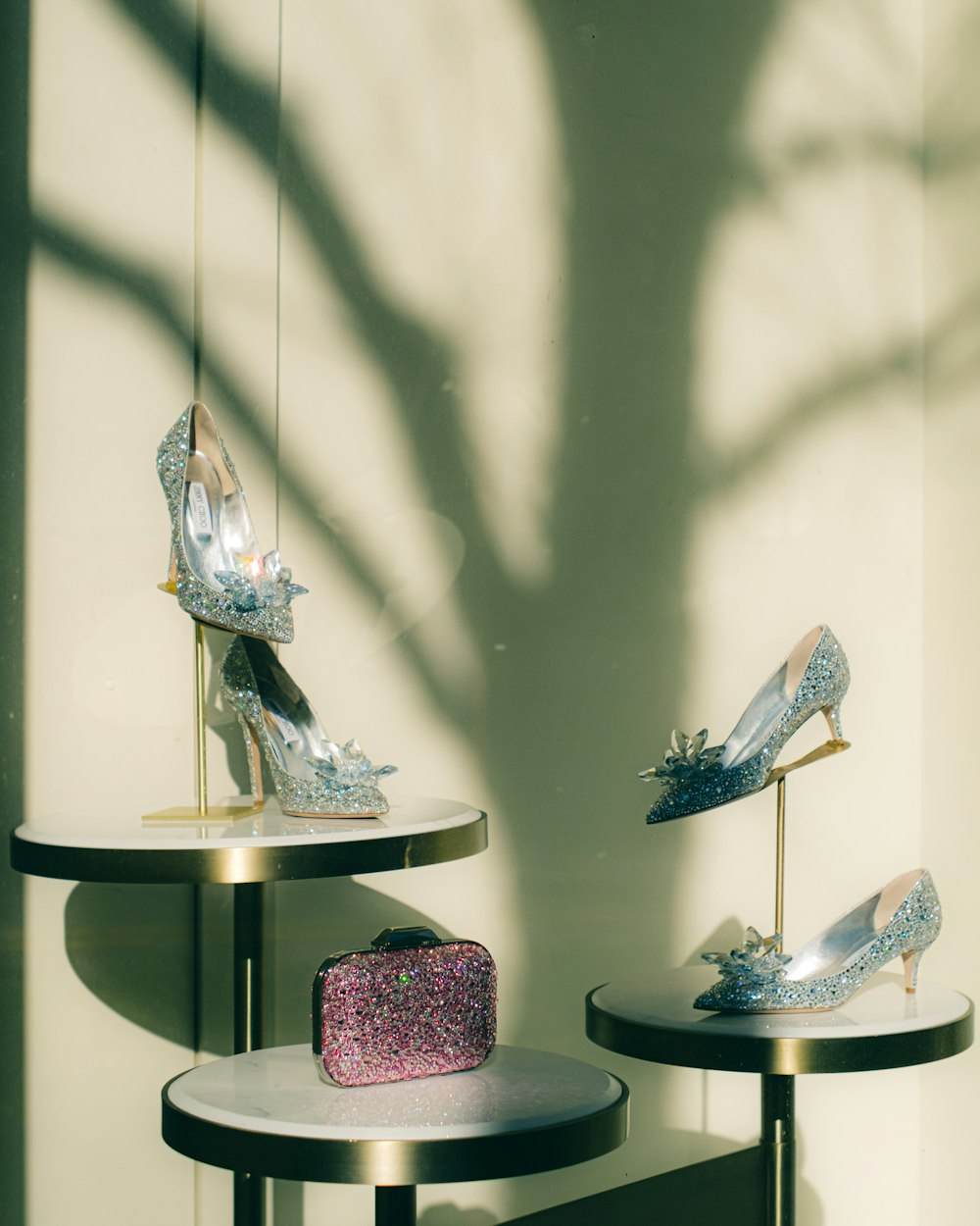 a display of shoes and a cake on a table