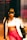 A stylish person wearing a cropped top, a trendy jacket with the word 'strength' visible, and vibrant pink pants. The individual is accessorized with sunglasses and layered necklaces, standing in what seems to be an elevator with metallic walls, under warm lighting that casts a golden hue.