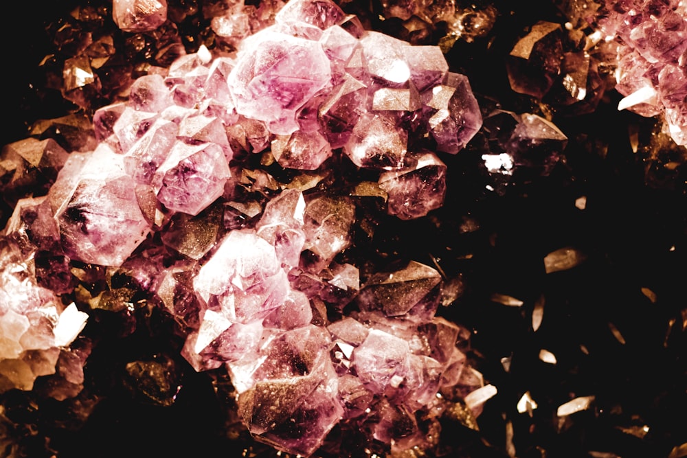 a pile of pink crystals sitting on top of a table