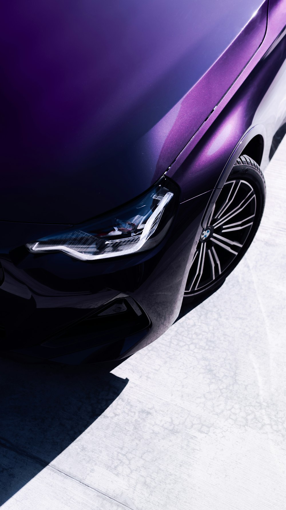 a close up of the front of a purple car