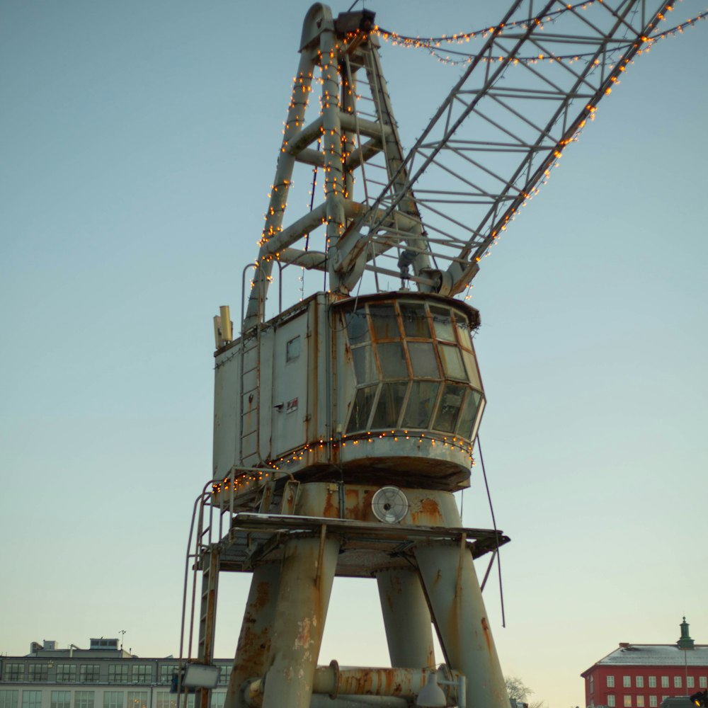 a large metal structure with lights on top of it