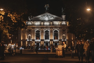 a group of people standing in front of a building