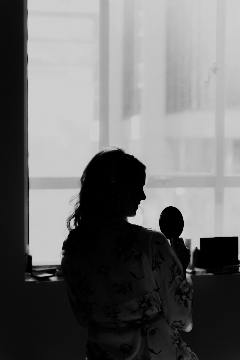 a person standing in front of a window