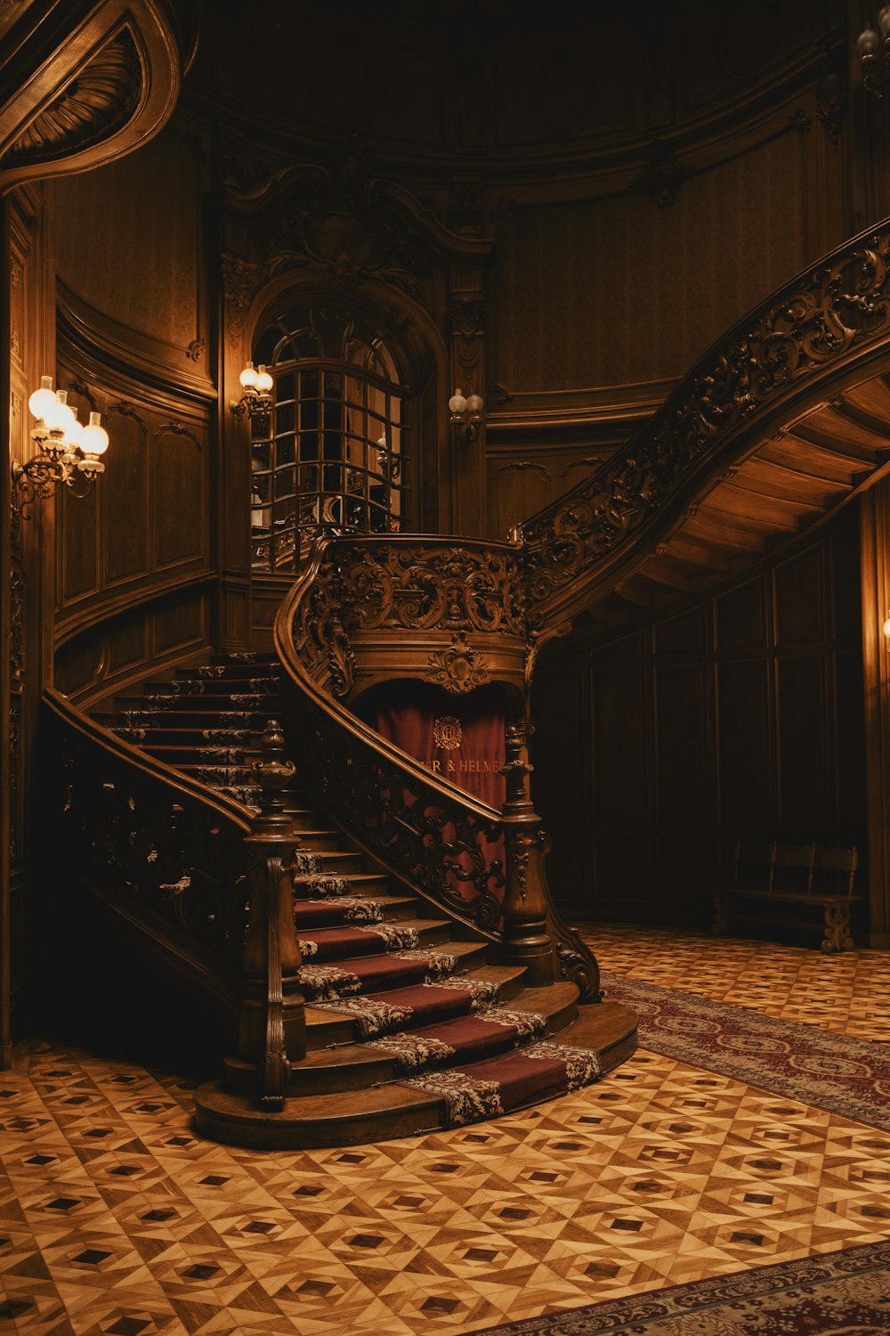 a staircase in a building with a chandelier