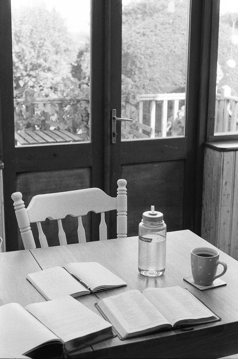 a table with a book and a cup on it