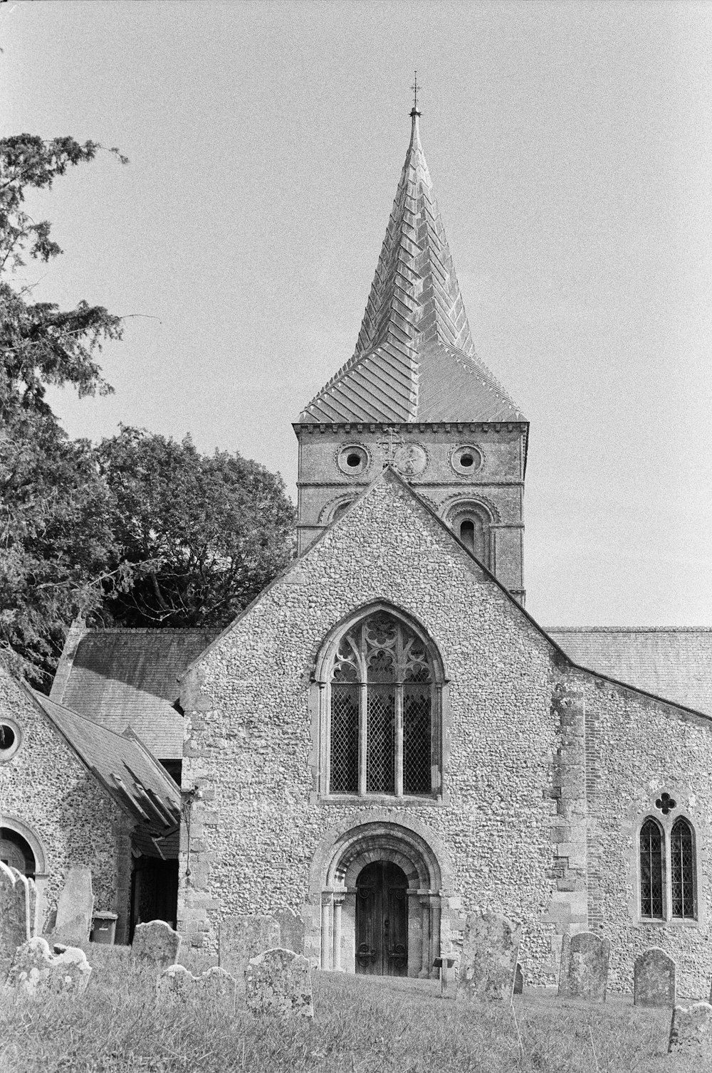 a black and white photo of an old church