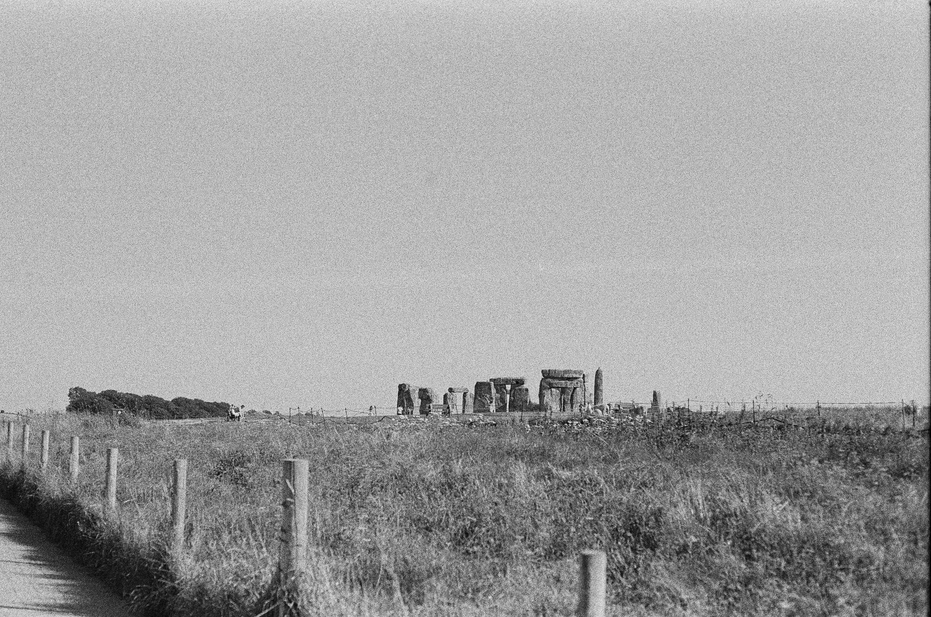 a black and white photo of a dirt road