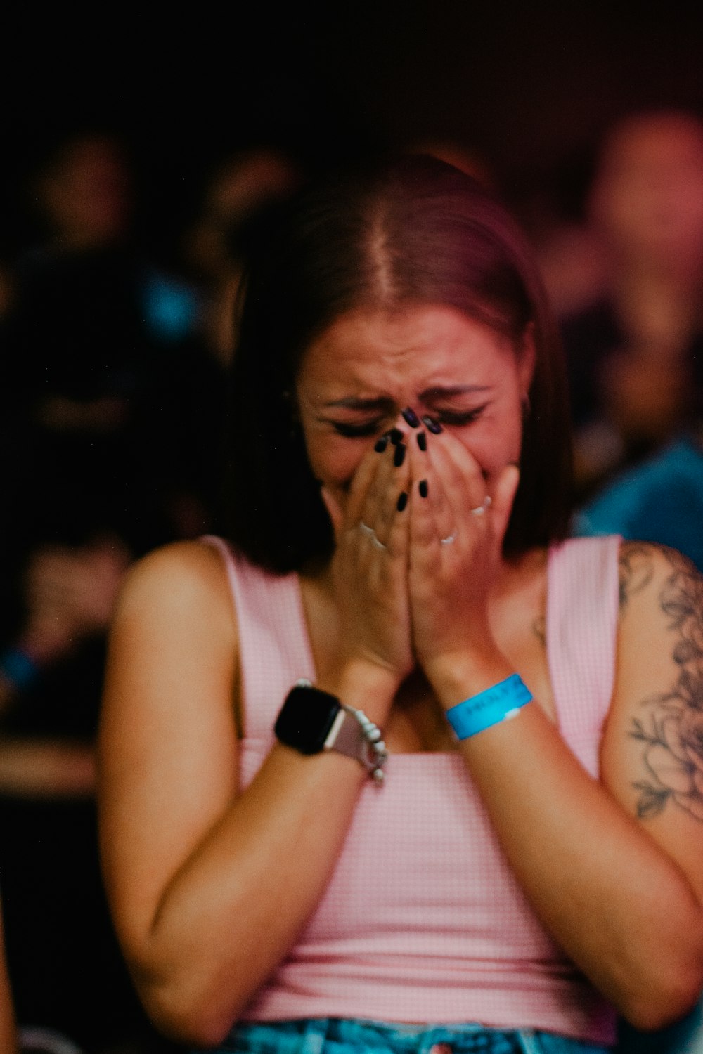 a woman covers her face with her hands