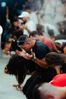 a group of people sitting on the ground