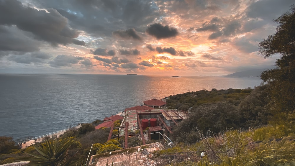 a house on a hill overlooking the ocean