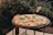 a pizza sitting on top of a black table