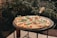 a pizza sitting on top of a black table
