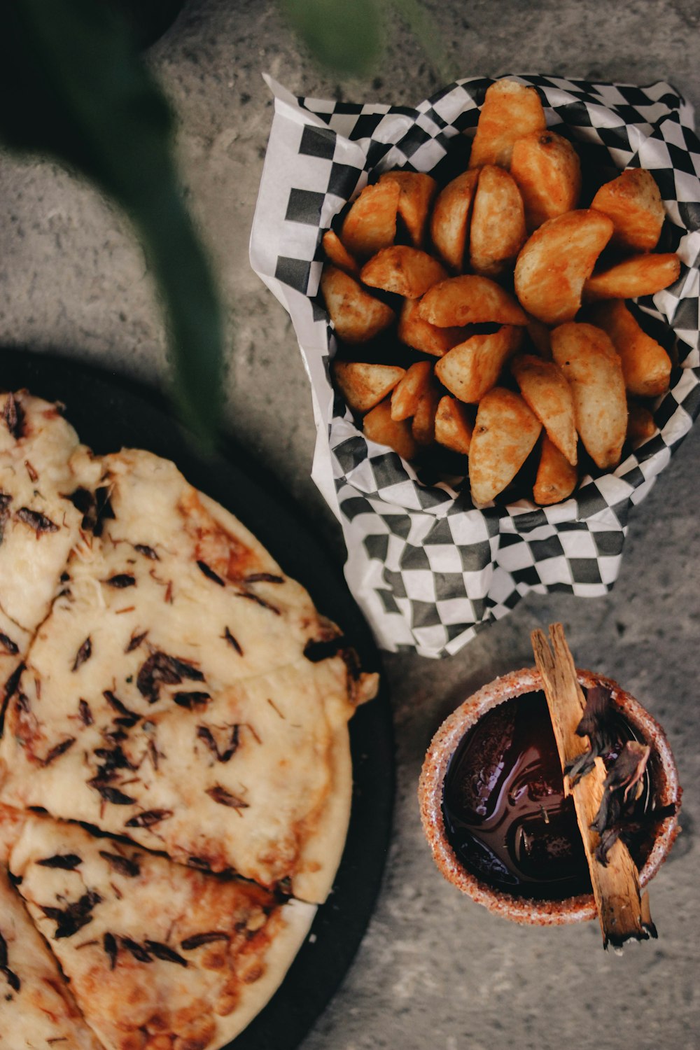 a plate of food next to a bowl of fries