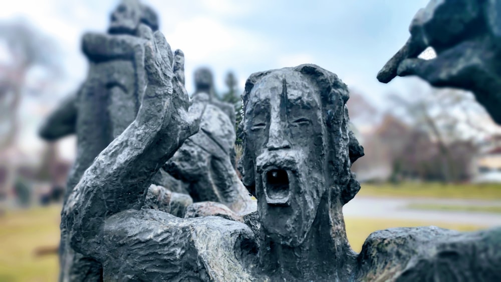 a close up of a statue of people holding hands