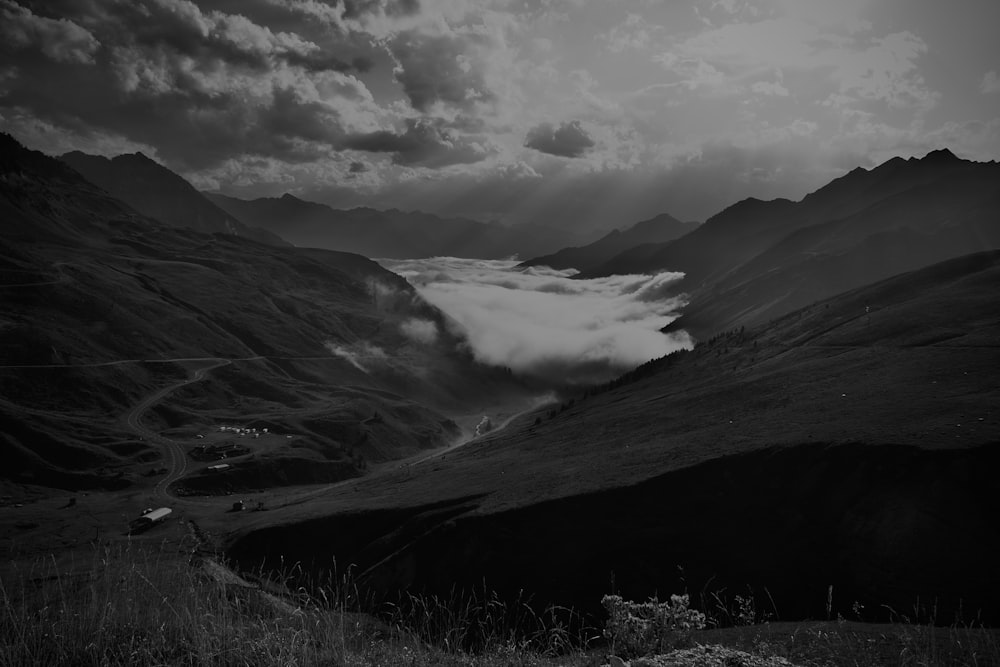 a black and white photo of a valley