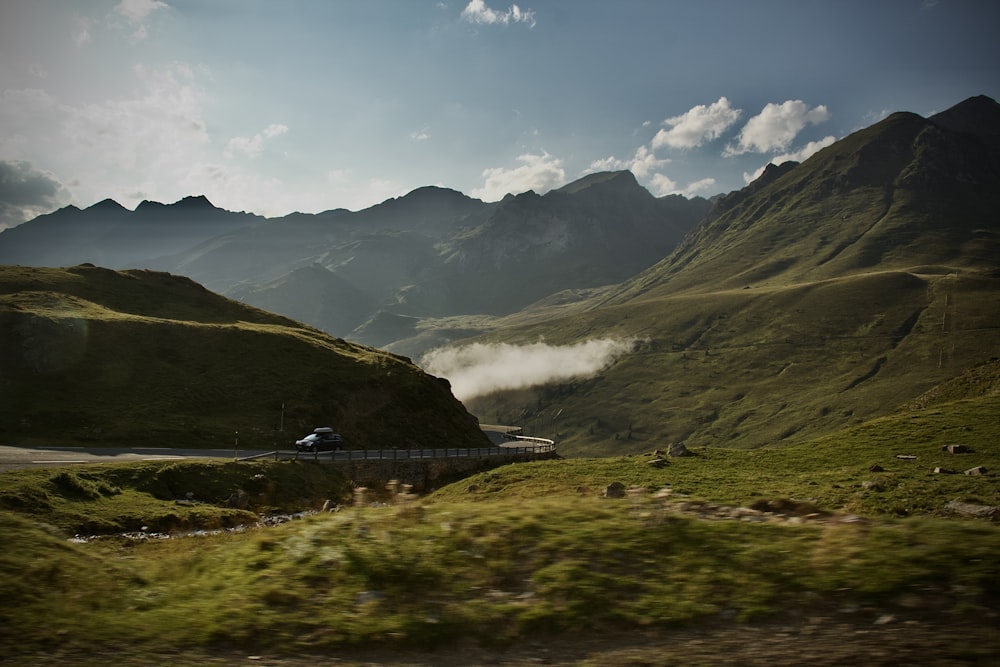 a train traveling through a lush green valley