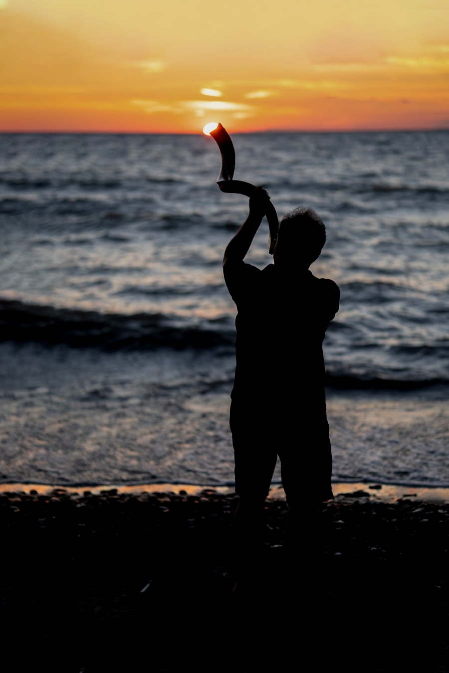 Traditional shofar horn resting on a prayer shawl