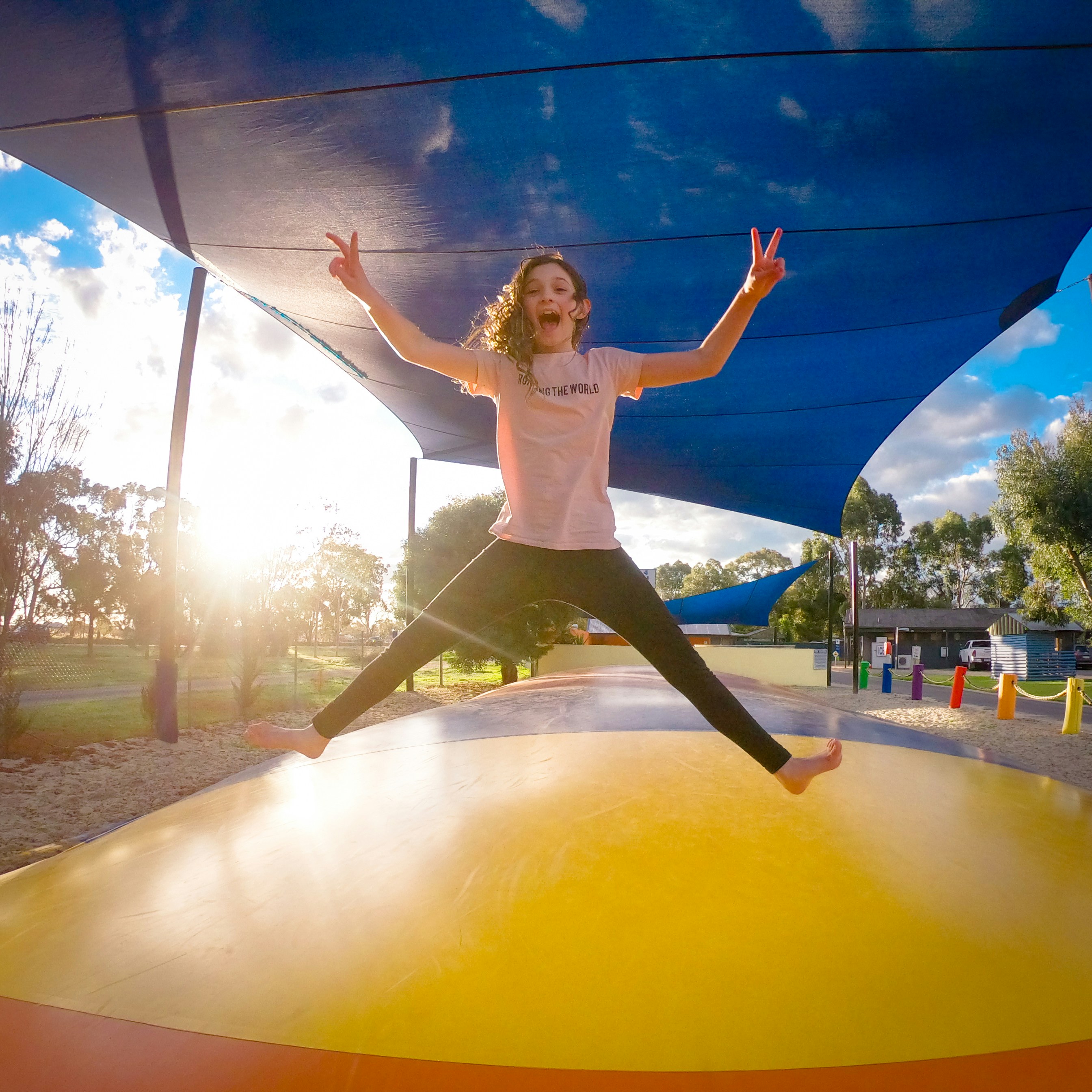 Child jumping on a trampoline