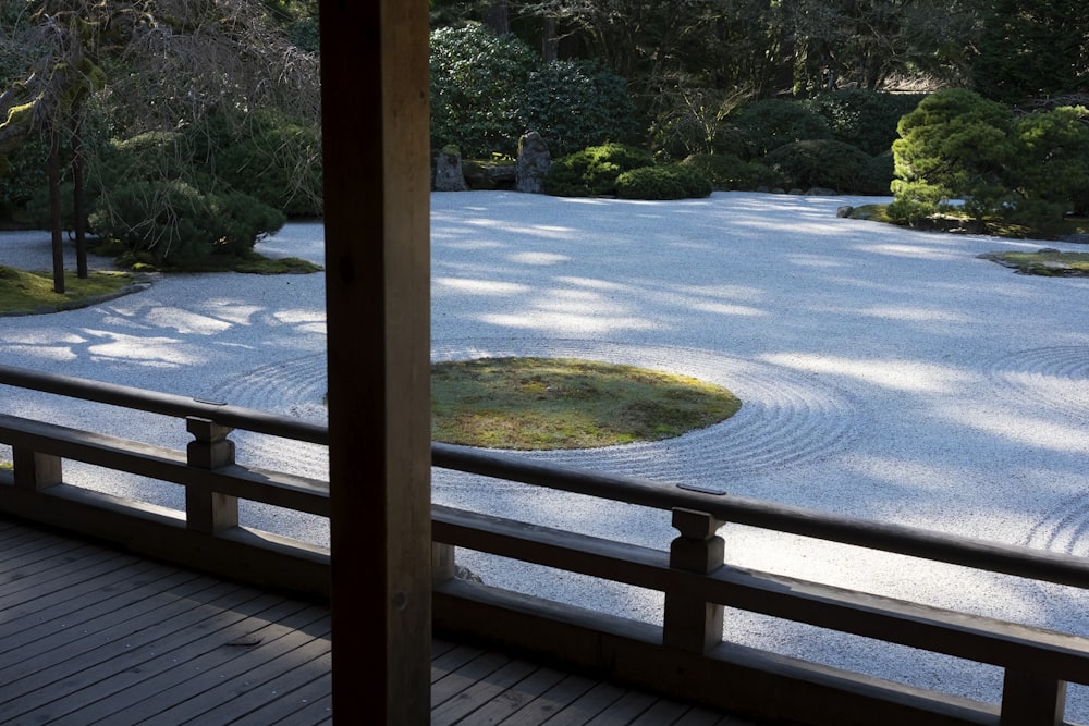 a view of a japanese garden from inside a building