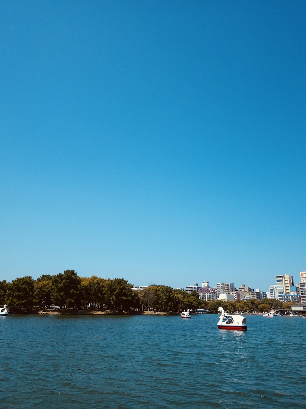 a large body of water with boats floating on it