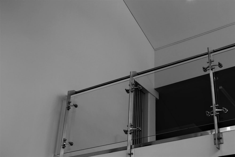 a black and white photo of a balcony railing