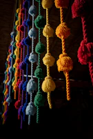 a bunch of tassels hanging from a ceiling
