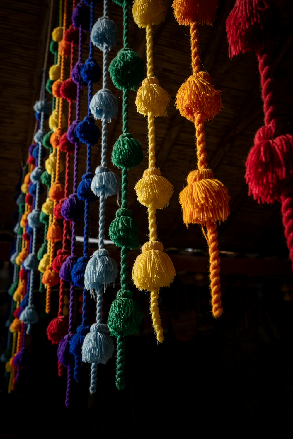 a bunch of tassels hanging from a ceiling