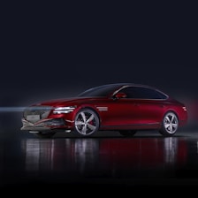 a red car parked in a dark room