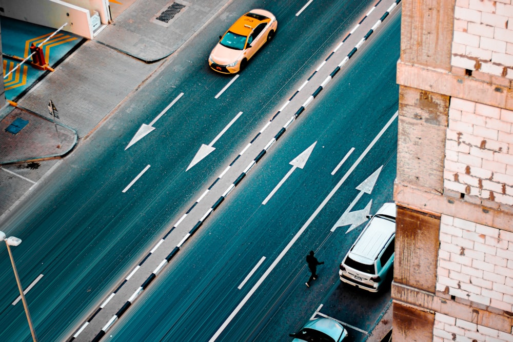 an overhead view of a street with cars and trucks