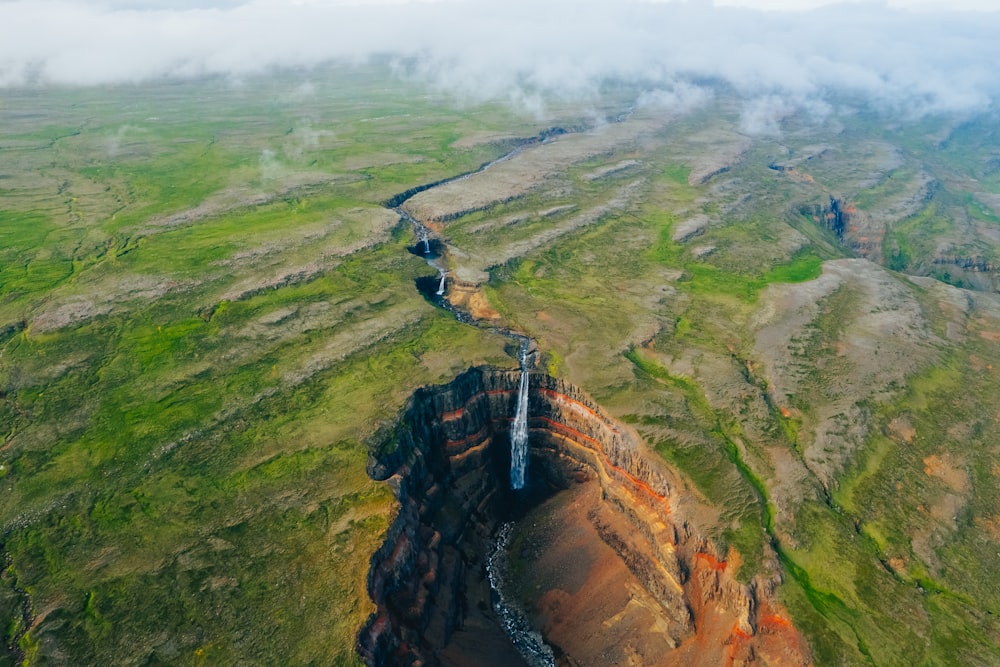 an aerial view of a mountain with a river running through it