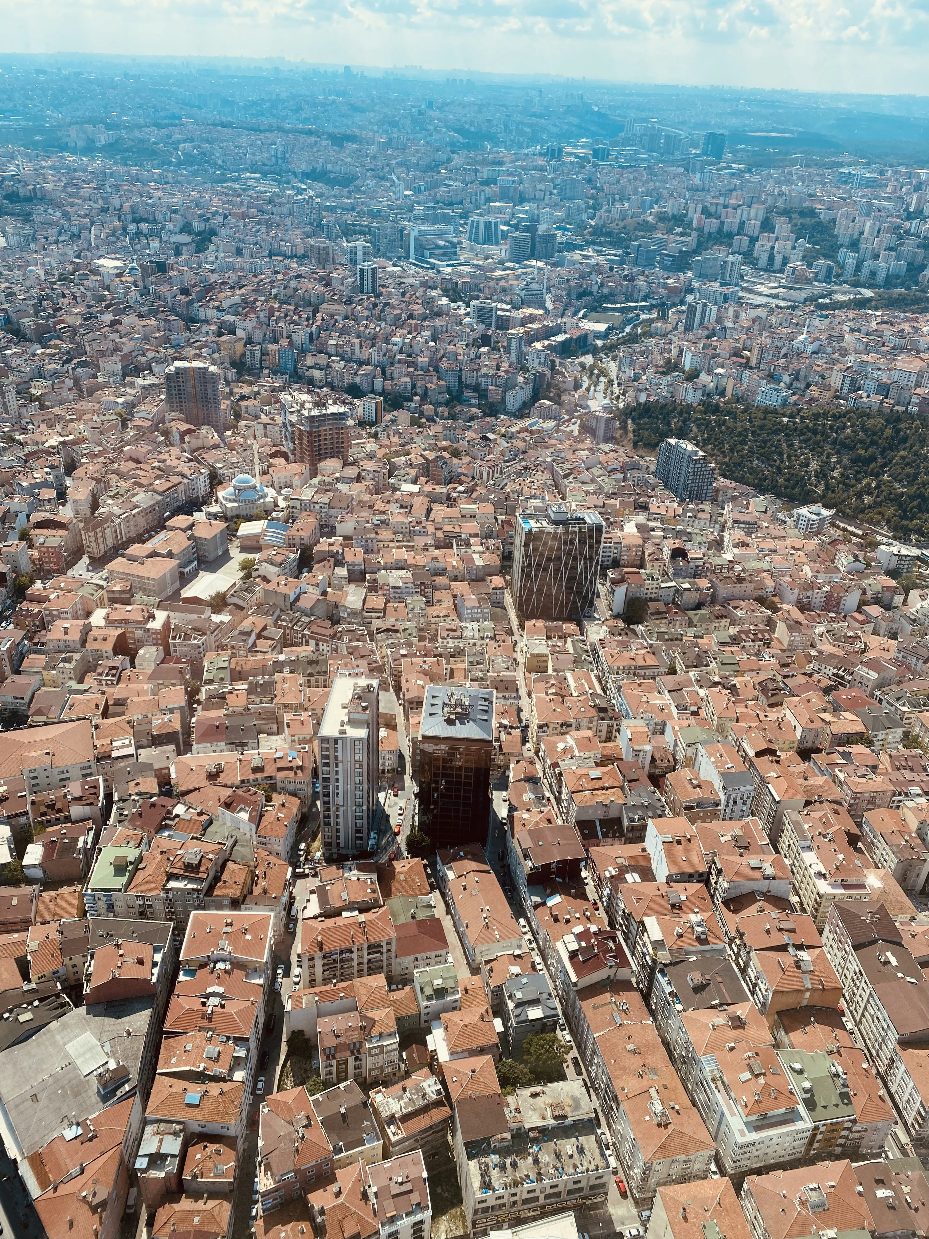 An aerial view of a city with tall buildings photo – Free Building ...