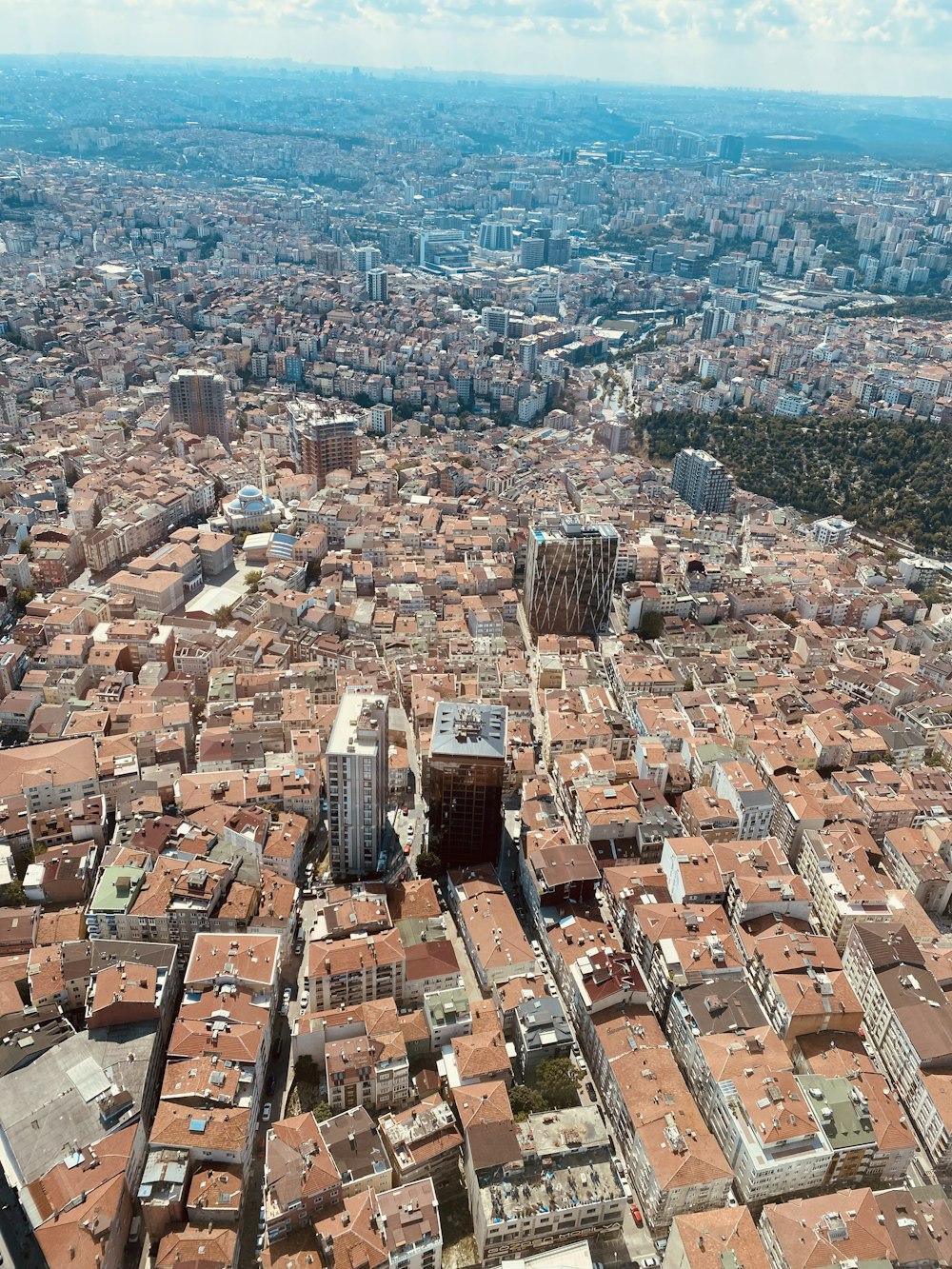 an aerial view of a city with tall buildings