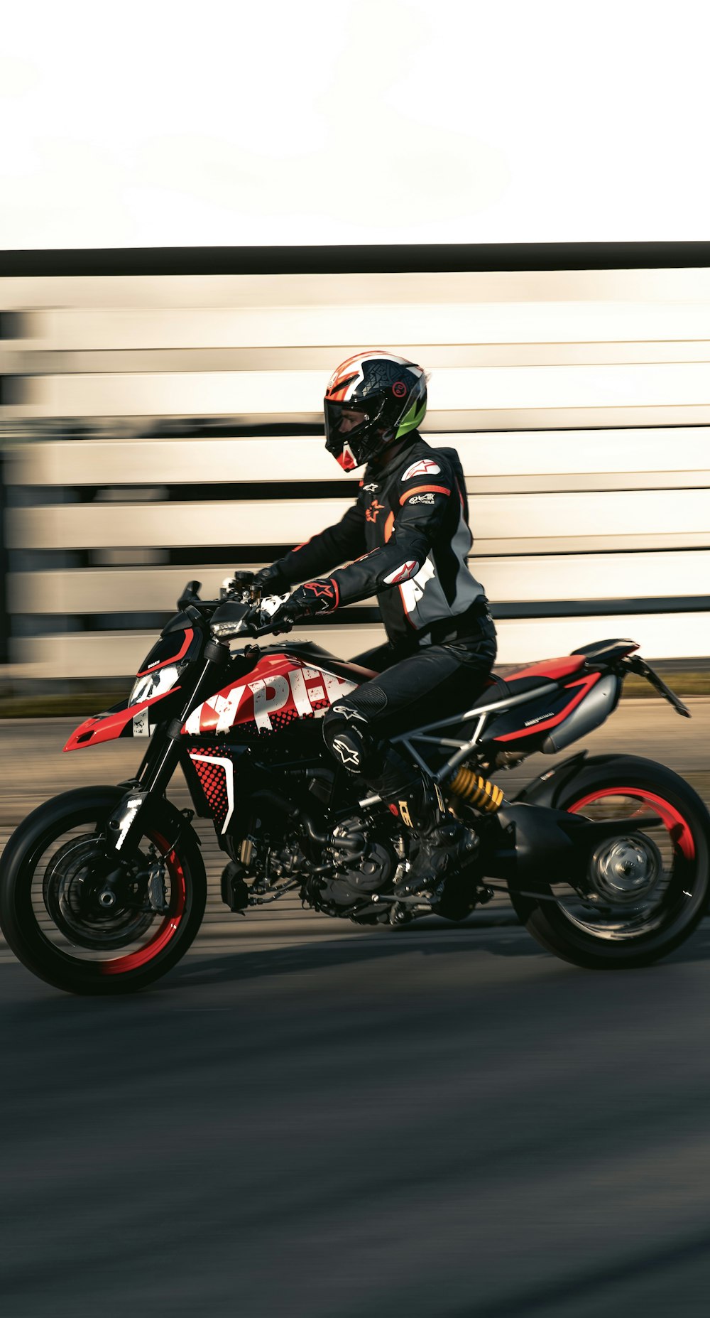 a man riding a motorcycle down a street