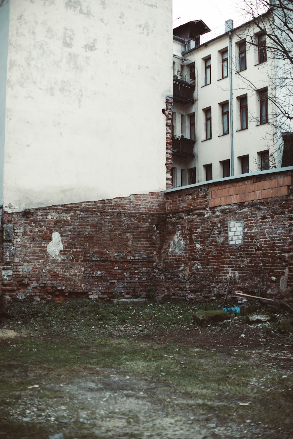 an old brick wall with graffiti on it