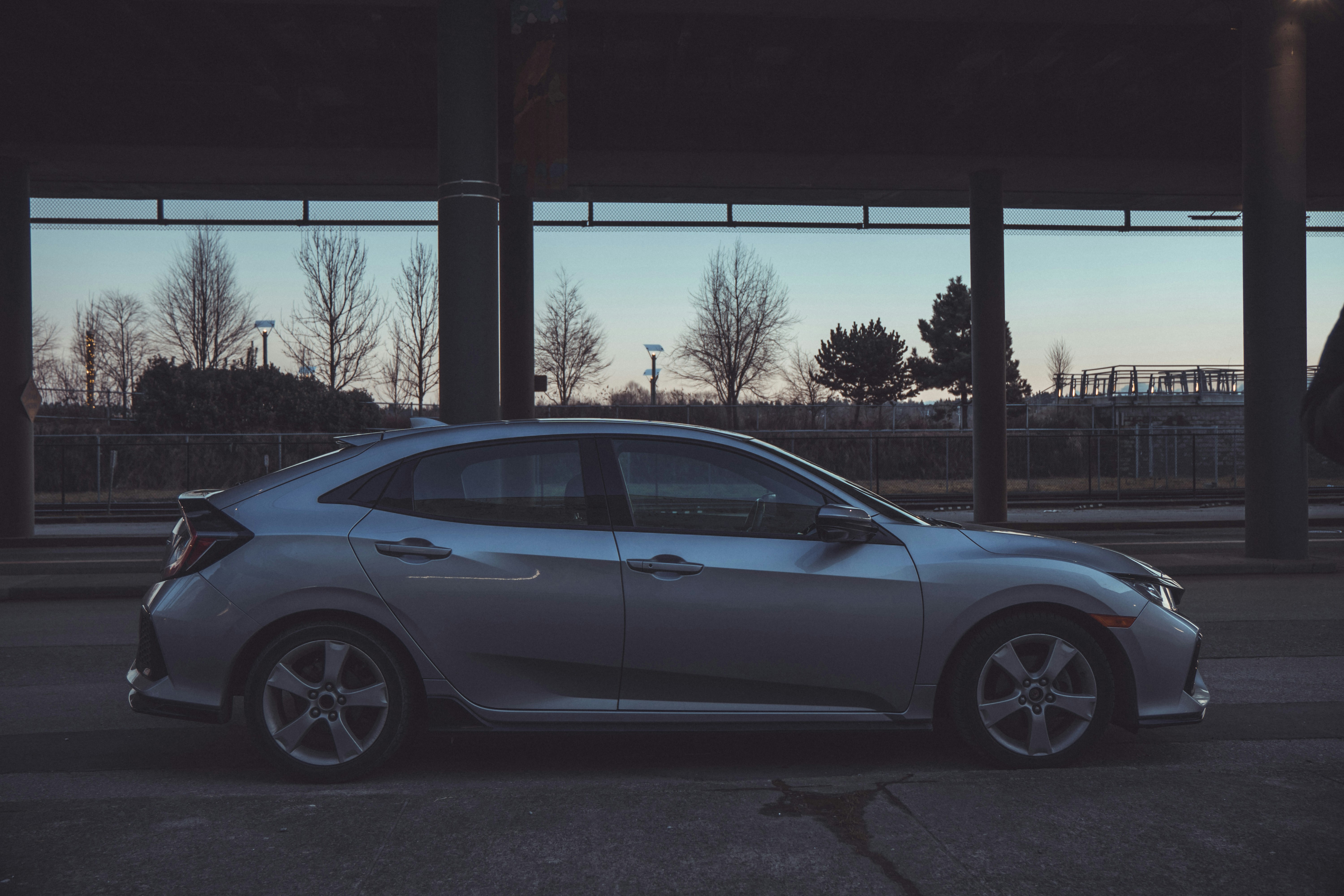 a silver car parked on the side of the road