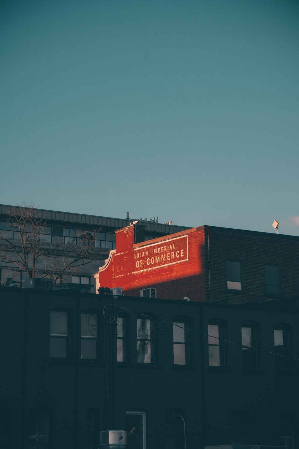 a large red sign on the side of a building