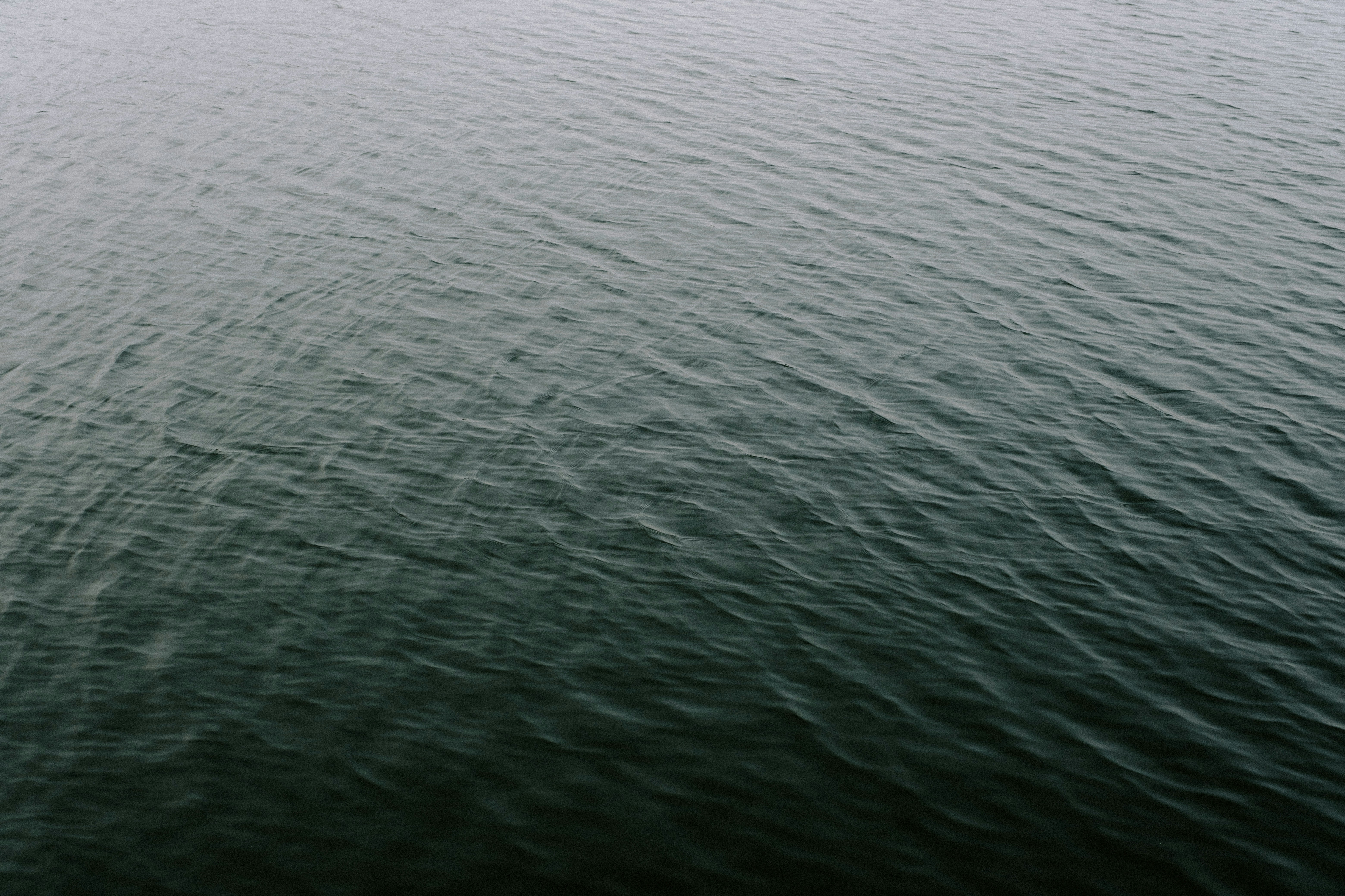 a boat floating on top of a large body of water