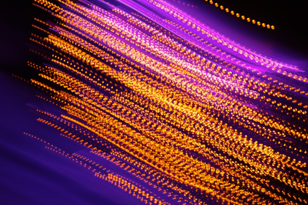 a close up of a purple and yellow background