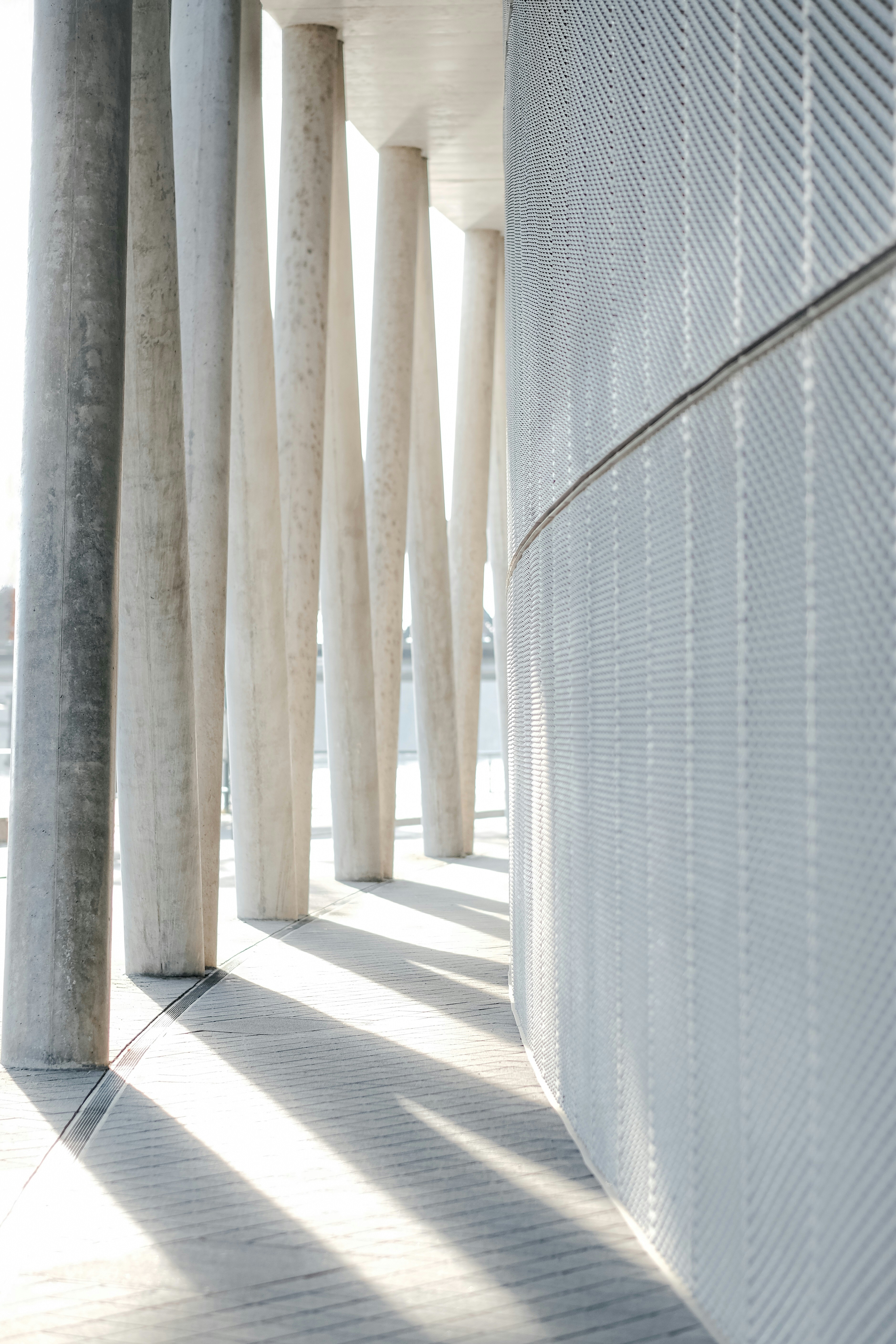 a man riding a skateboard down a sidewalk