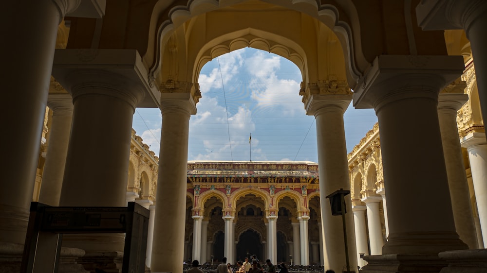 a group of people standing in a large building