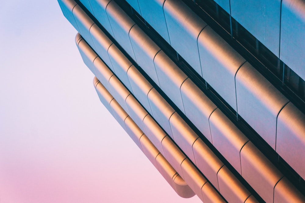 a close up of a building with a sky in the background