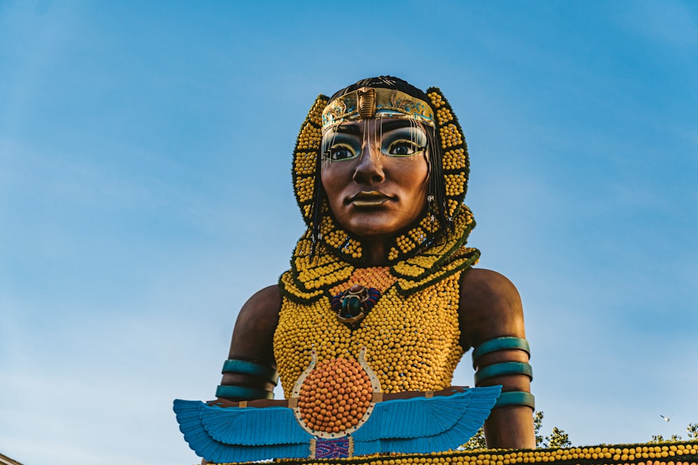 a statue of a woman with a bird on her shoulder