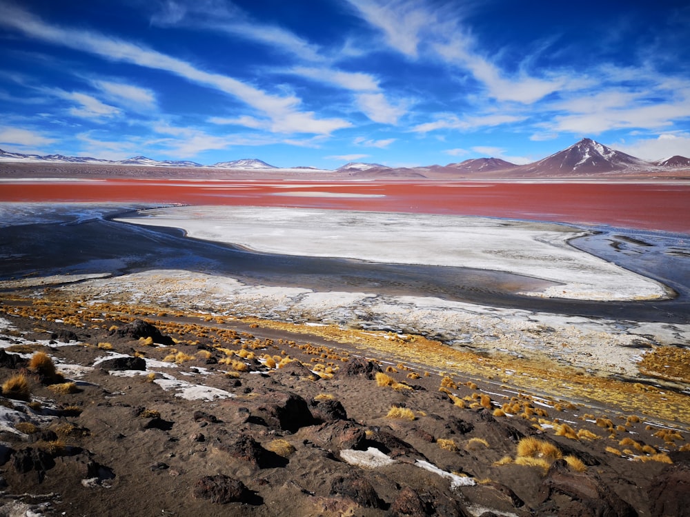 a view of a lake with mountains in the background