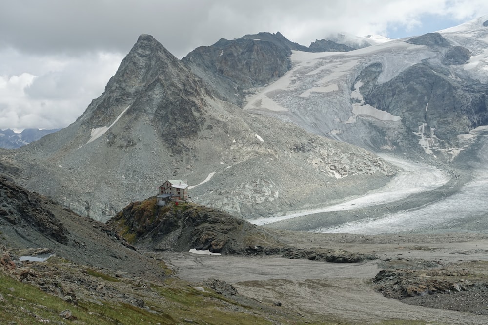 a mountain with a house on top of it