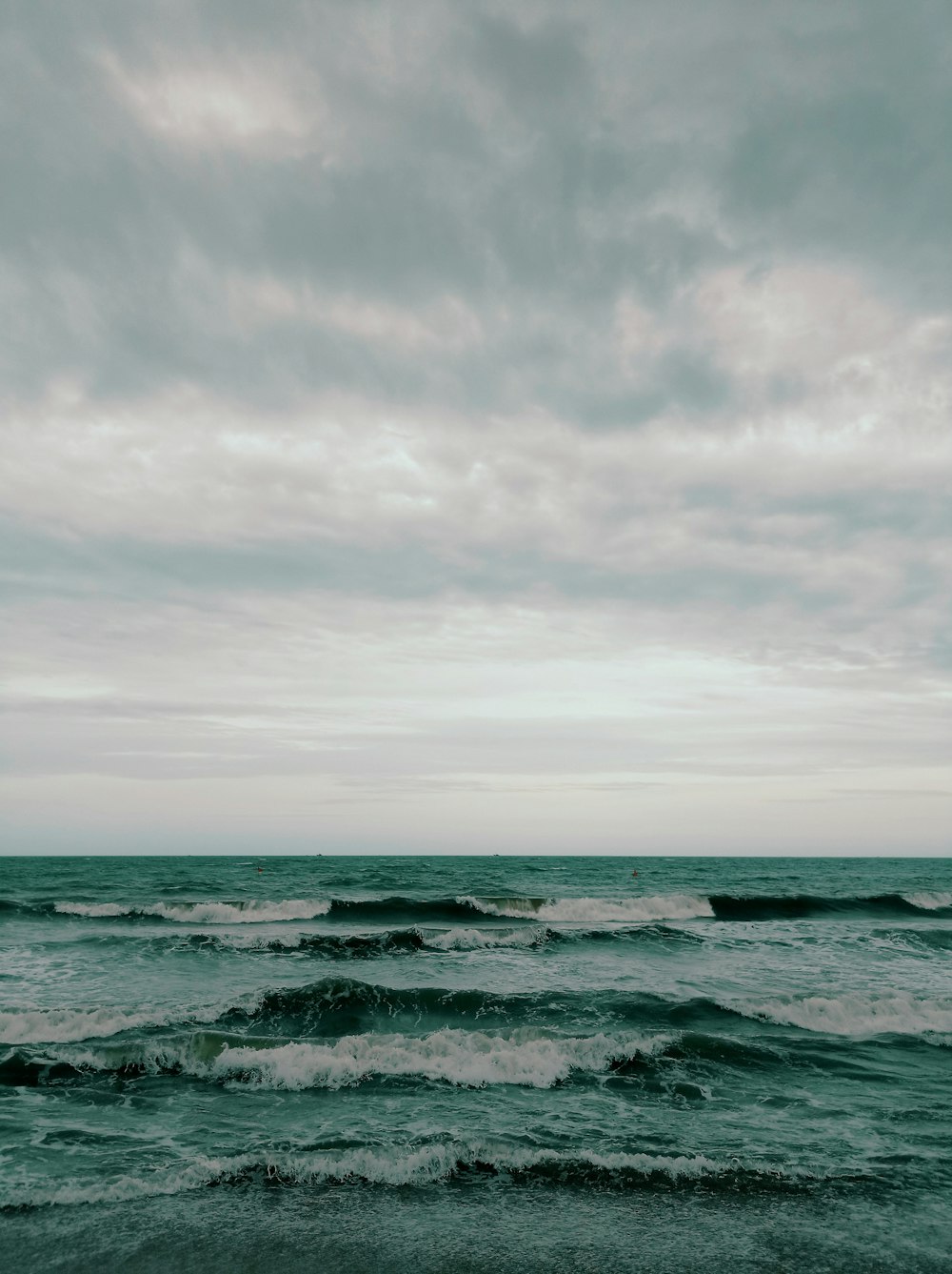 a body of water with waves coming in to shore