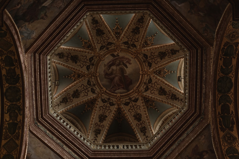 the ceiling of a building with a painting on it