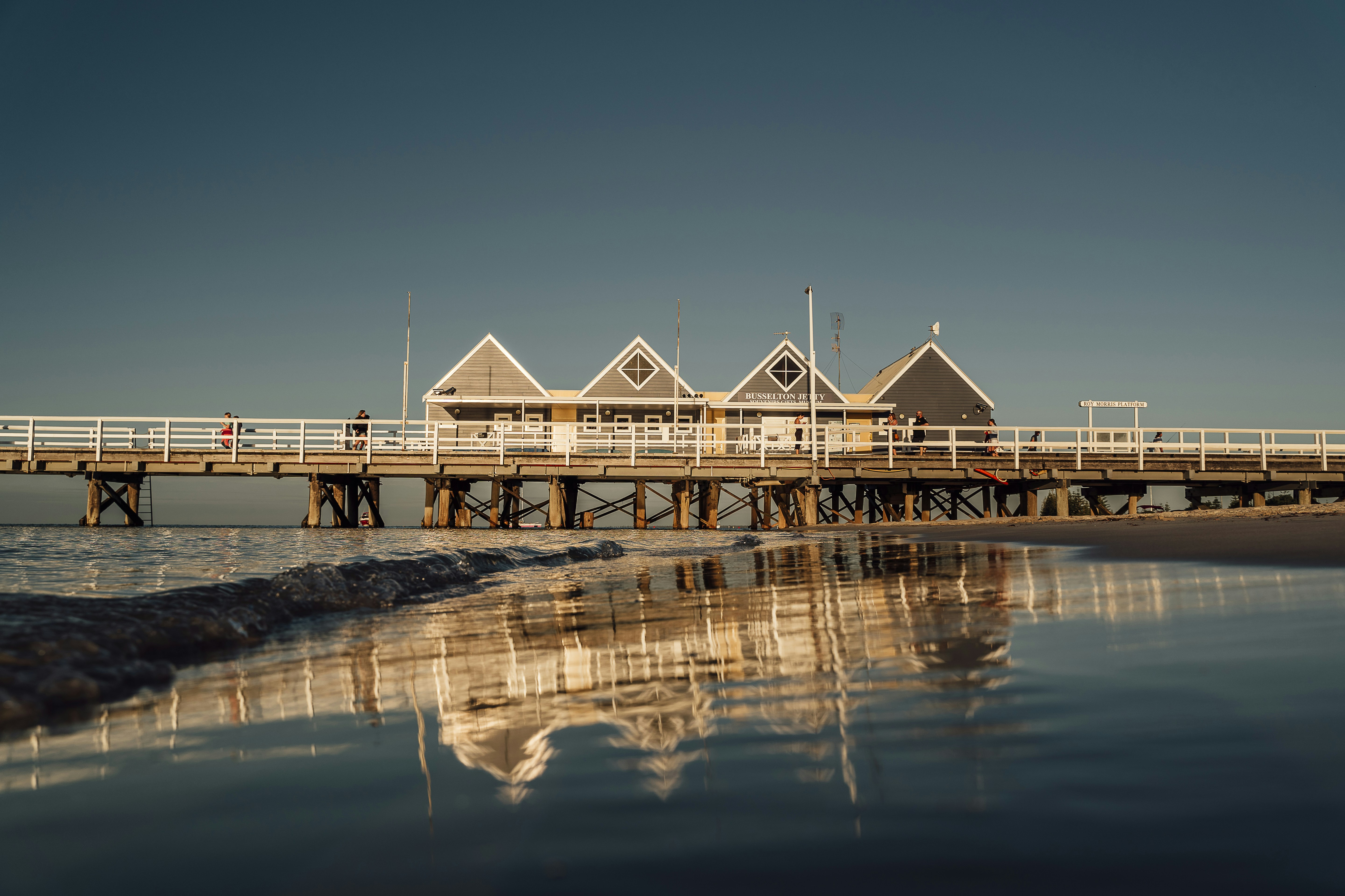 a pier that has some houses on top of it